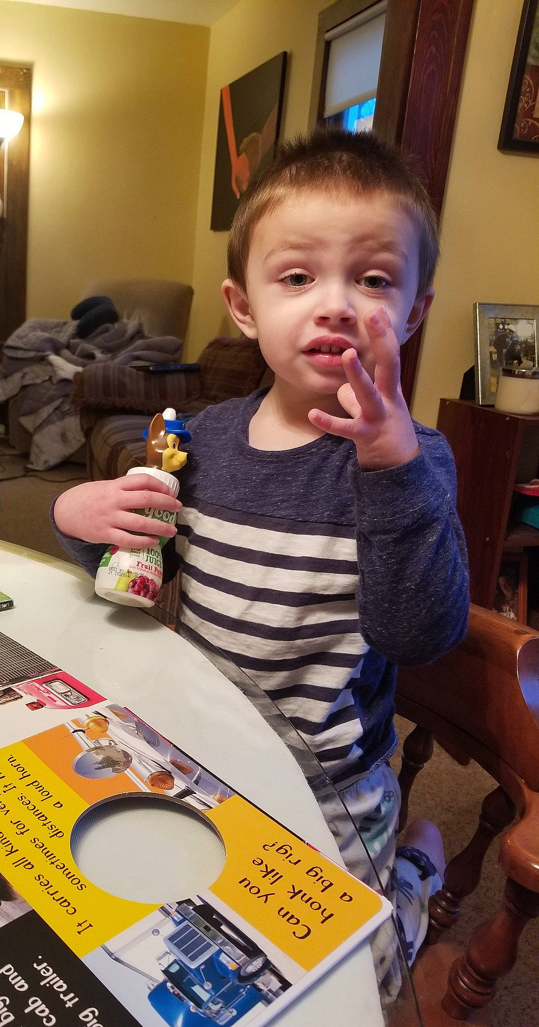 Jason Jr is registered to the contest to win money with this photo: adhesive_tape, baby, chair, child, comfort_food, cuisine, event, food, fun, holiday, junk_food, person, picture_frame, plate, play, sharing, surprise, sweetness, t_shirt, table