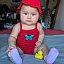 baby, infant, toddler, red_hat, red_outfit, butterfly_patch, rubber_duck, socks, blanket, bed, indoor, portrait, chubby_cheeks, sitting, toy, mirror, dresser, cute, photography, child