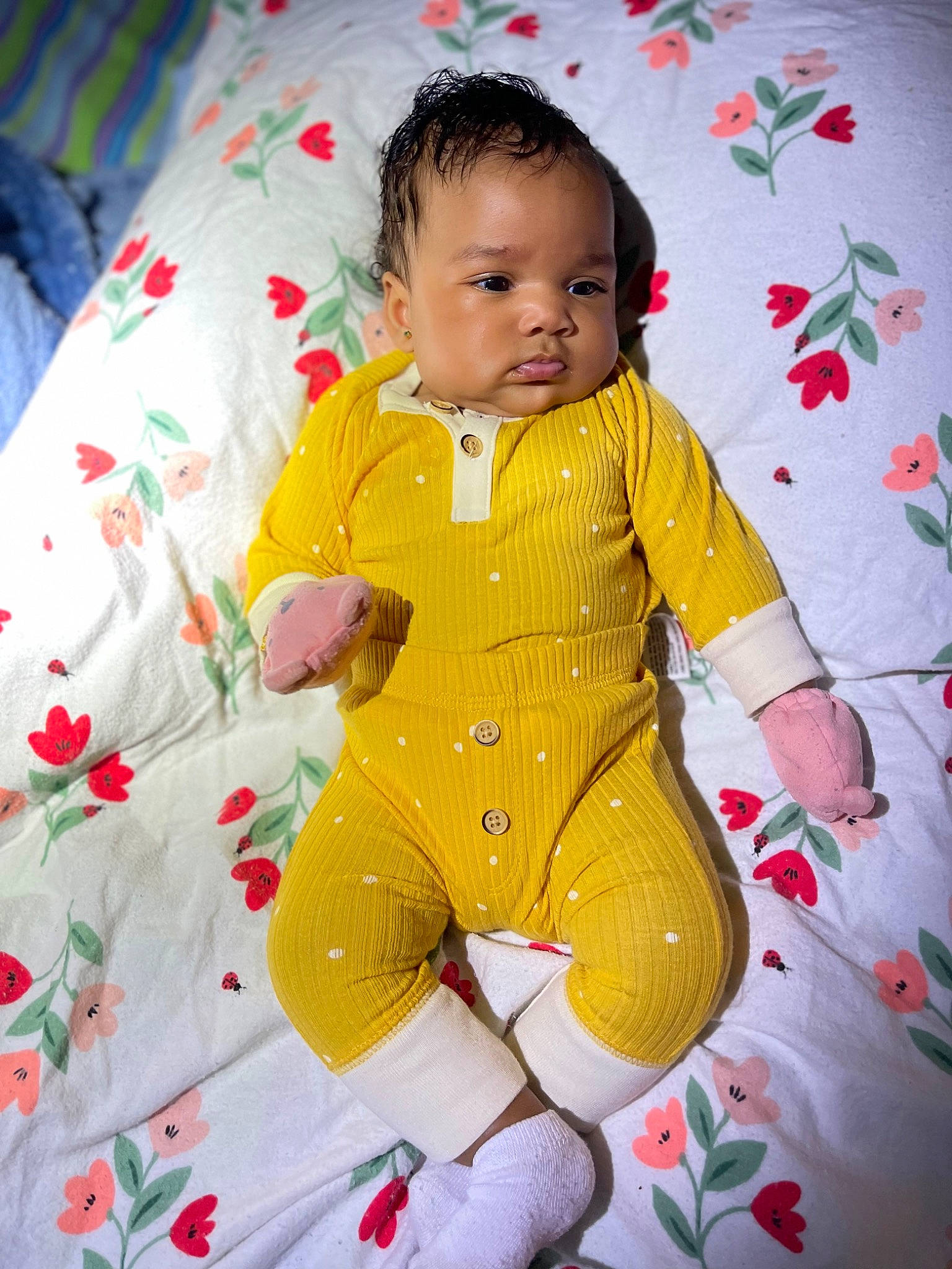 Alani is registered to the contest to win money with this photo: arm, baby, baby_toddler_clothing, cheek, child, comfort, face, flooring, hand, happy, head, linens, outerwear, pattern, person, product, skin, sleeve, t_shirt, textile