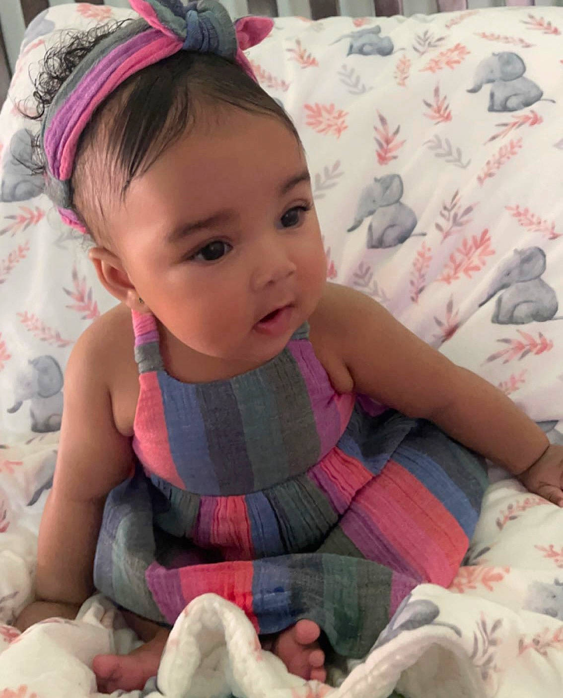 Alani is registered to the contest to win money with this photo: arm, baby, baby_toddler_clothing, cheek, comfort, eye, face, finger, hand, happy, head, human, lip, organ, person, pink, product, skin, sleeve, textile