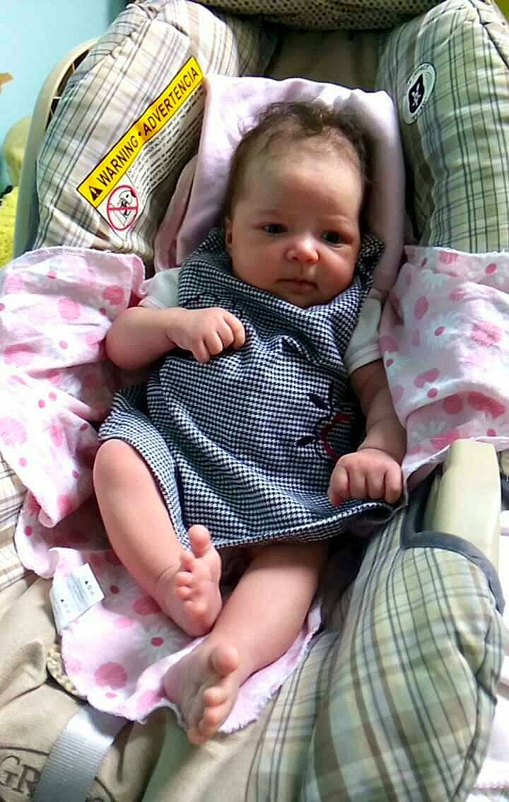 Izabelle is registered to the contest to win money with this photo: abdomen, baby_carriage, baby_products, car_seat, child, day, fun, girl, infant, pattern, person, plaid, product, sitting, toddler