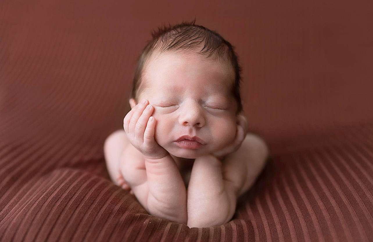 Rowan is registered to the contest to win money with this photo: arm, baby, baby_toddler_clothing, cheek, comfort, eye, face, flash_photography, gesture, hair, happy, head, human_body, lip, nail, neck, nose, person, thumb, toddler