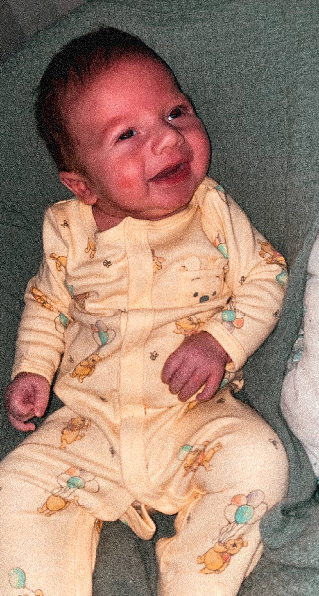 Rowan is registered to the contest to win money with this photo: arm, baby, baby_toddler_clothing, cheek, collar, dress, eye, face, hand, head, human_body, iris, lip, mouth, nose, outerwear, person, pink, skin, sleeve