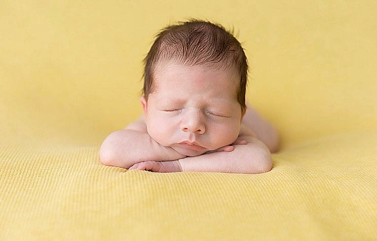 Rowan is registered to the contest to win money with this photo: baby, baby_toddler_clothing, cheek, comfort, eyelash, flash_photography, flooring, fun, gesture, grass, hand, happy, hardwood, linens, nail, nose, person, portrait_photography, thumb, toddler