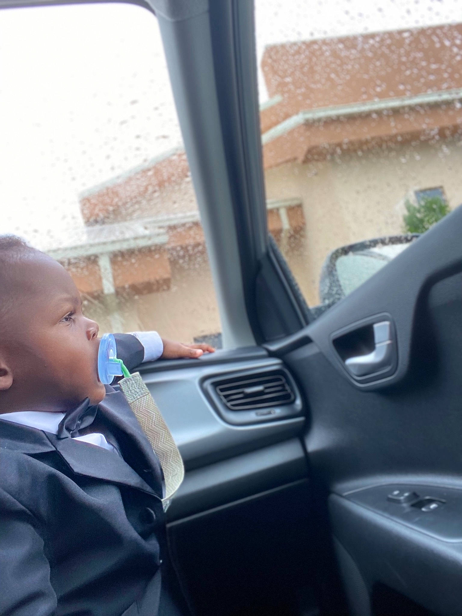 Micheal is registered to the contest to win money with this photo: auto_part, automotive_design, automotive_exterior, automotive_mirror, automotive_window_part, car, car_seat, face, family_car, glass, luxury_vehicle, motor_vehicle, person, personal_luxury_car, rear_view_mirror, steering_part, steering_wheel, toddler, vehicle, vehicle_door