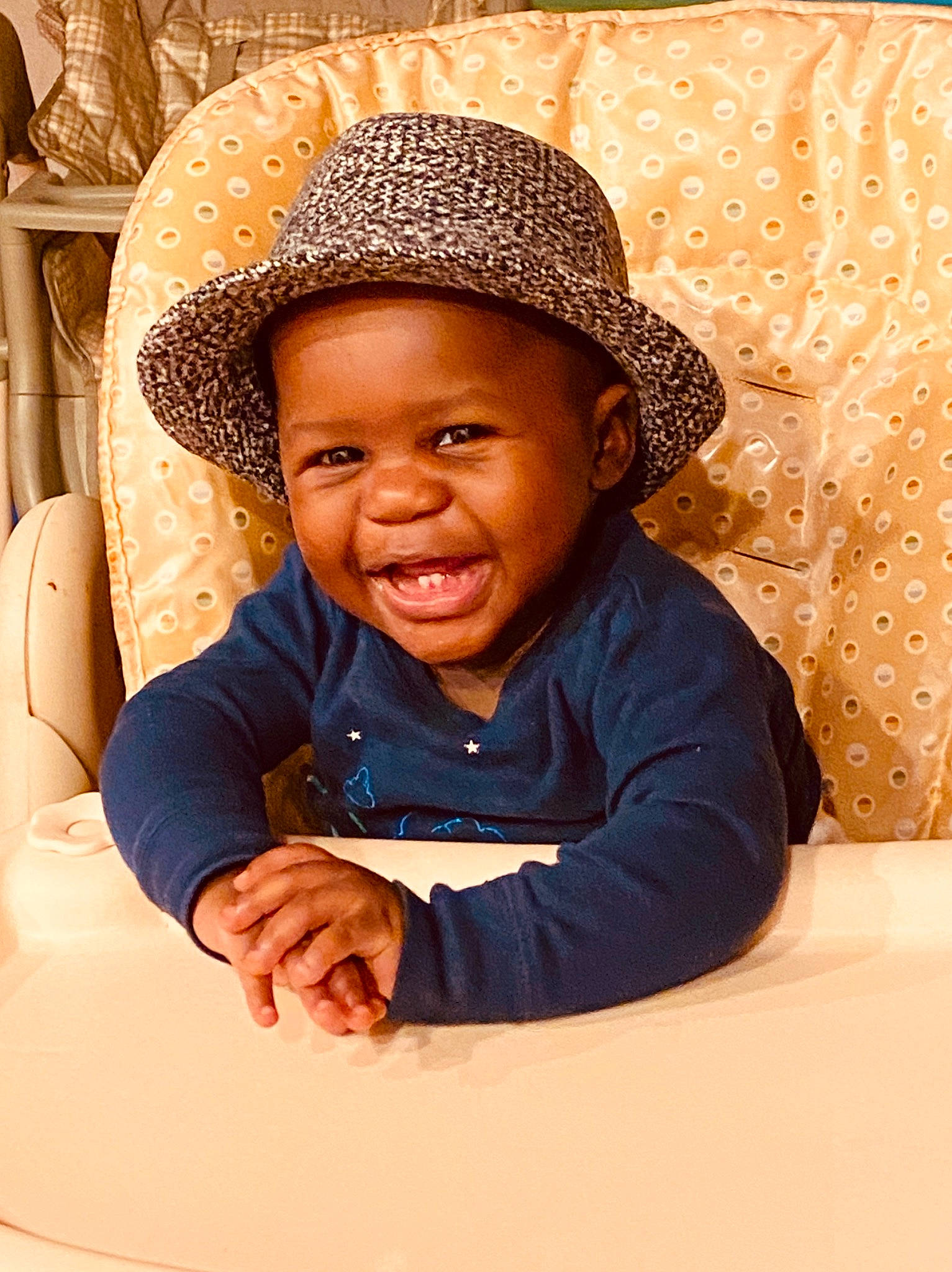 Micheal joined the competition — help win amazing prizes! baby, child, child_model, facial_expression, fashion_accessory, fun, happy, hat, headgear, person, photography, portrait_photography, sitting, skin, smile, sun_hat, toddler