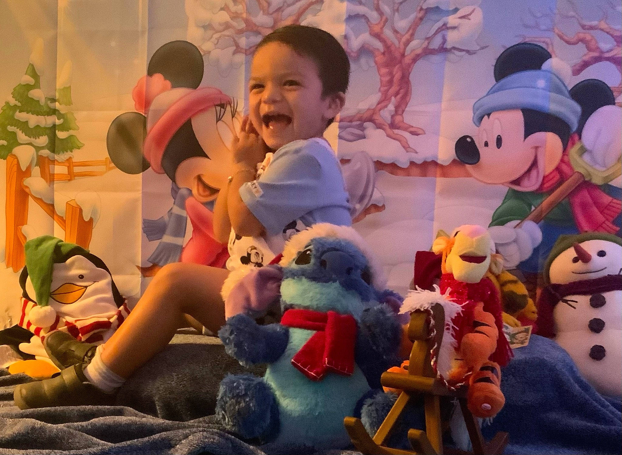 Niko is registered to the contest to win money with this photo: animation, art, child, doll, event, fun, happy, hat, holiday, interaction, joy, lawn_ornament, leisure, person, smile, social_group, stuffed_toy, textile, toddler, toy