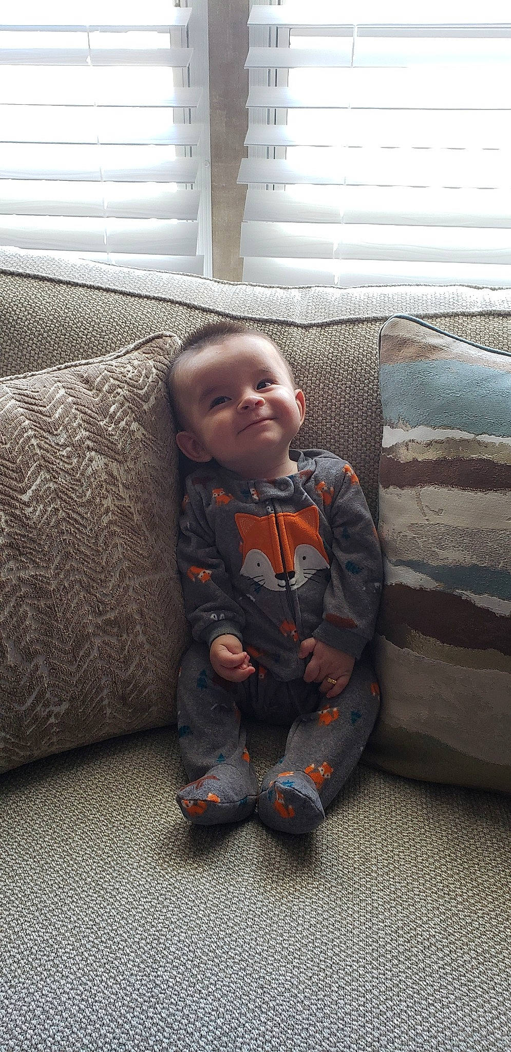 Miguel is registered to the contest to win money with this photo: child, day, flooring, fun, furniture, person, sitting, standing, textile, toddler, wood