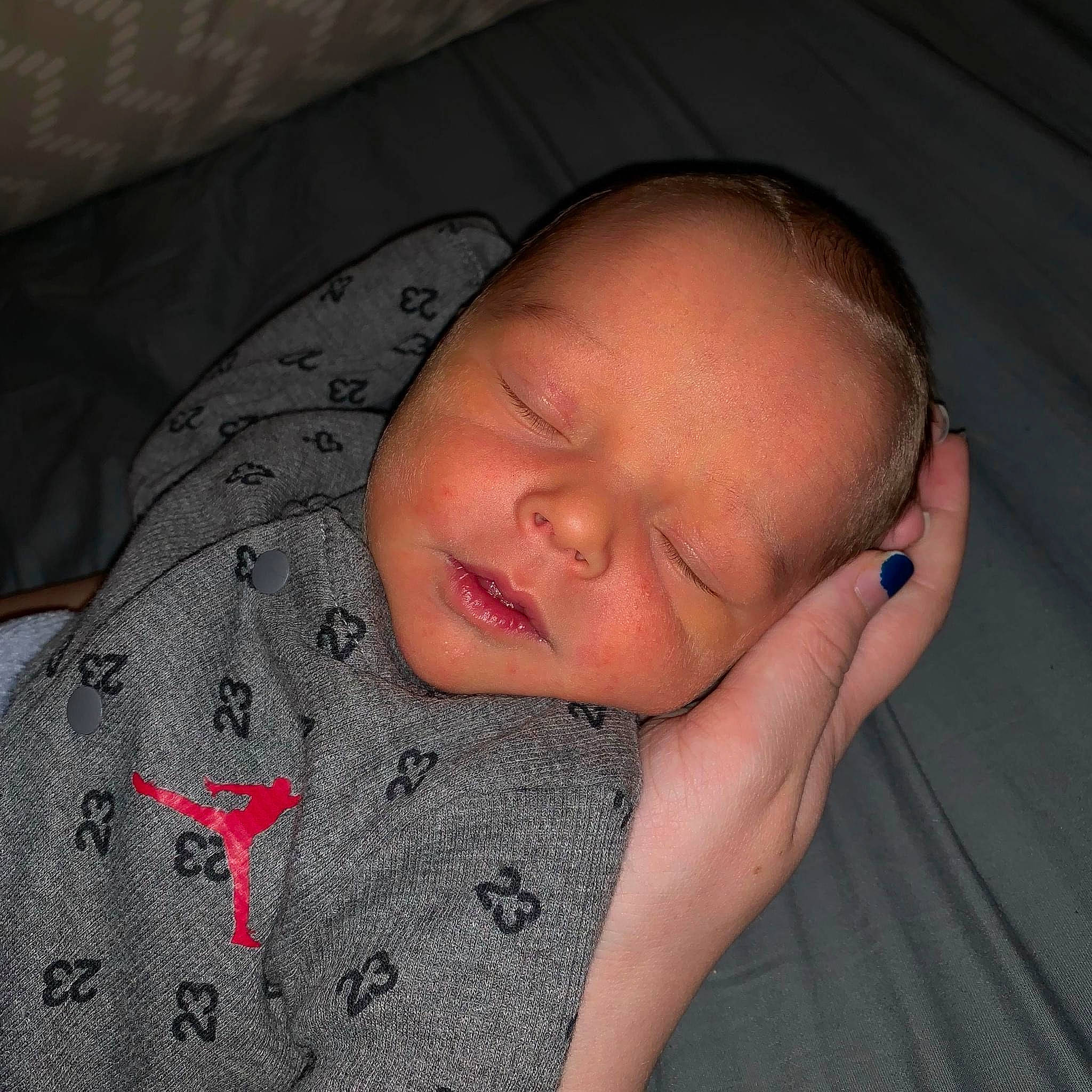 Kyle is registered to the contest to win money with this photo: baby, baby_sleeping, baby_toddler_clothing, cheek, chin, comfort, eye, eyebrow, face, finger, forehead, gesture, head, lip, mouth, nose, person, skin, sleeve, smile