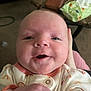 Desirae is registered to the contest to win money with this photo: baby, babylaughing, bodypart, face, finger, hand, happy, head, laughing, mouth, newborn, person, photography, portrait, quilt, smile, wrist