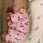 Desirae is registered to the contest to win money with this photo: baby, bed, blanket, clothing, crib, face, furniture, head, infantbed, newborn, pajamas, person, sleeping, yawning