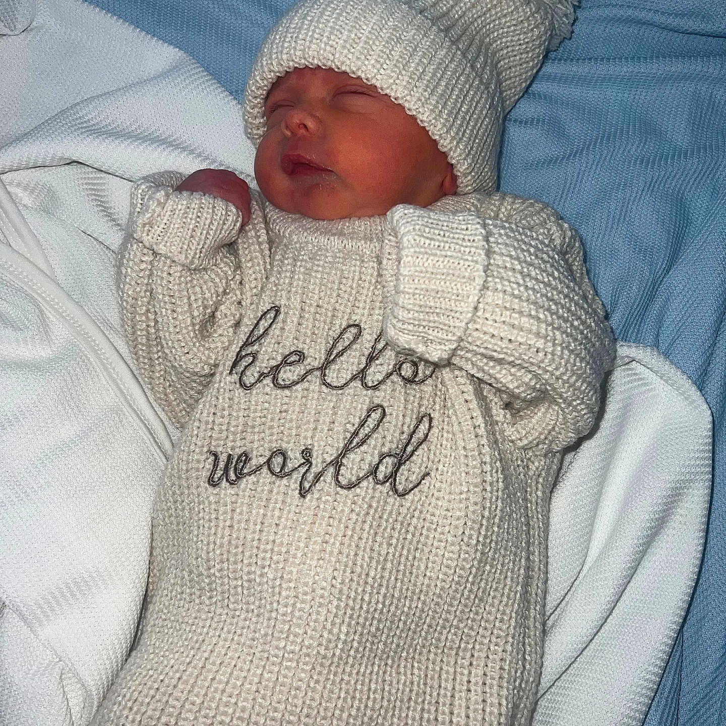 Marc Jr joined the competition — help win amazing prizes! baby, blanket, blue_blanket, child, cozy, cute, face, infant, knitted_hat, knitted_outfit, newborn, peaceful, person, portrait, resting, sleep, sleeping, soft_texture, warm_clothing, white_clothing