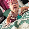 Charlotte joined the competition — help win amazing prizes! baby, infant, headband, pink_bow, pacifier, blanket, blue_eyes, cute, child, portrait, indoors, closeup, face, expression, lying_down, clothing, soft_light, curious, young_child, adorable