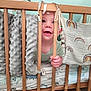 Eliott a rejoint le concours — aidez-le/la à gagner de superbes lots ! baby, blanket, blue_wall, child, crib, cute, face, grip, hand, happy, indoors, infant, mattress, patterned_sheet, room, smile, soft_texture, toddler, toy, wooden_bars