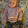 Amara joined the competition — help win amazing prizes! baby, infant, headband, pink_clothing, floral_leggings, blanket, patterned_blanket, lying_down, curious_expression, indoors, child, cute, small_hands, portrait, soft_lighting, baby_fashion, headwear, person, young_child, comfortable
