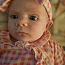 Amara is registered to the contest to win money with this photo: baby, infant, face, headband, clothing, pink, checkered, hello_kitty, closeup, portrait, child, young, cute, apparel, person, indoors, soft_lighting, expressionless, head, wearing