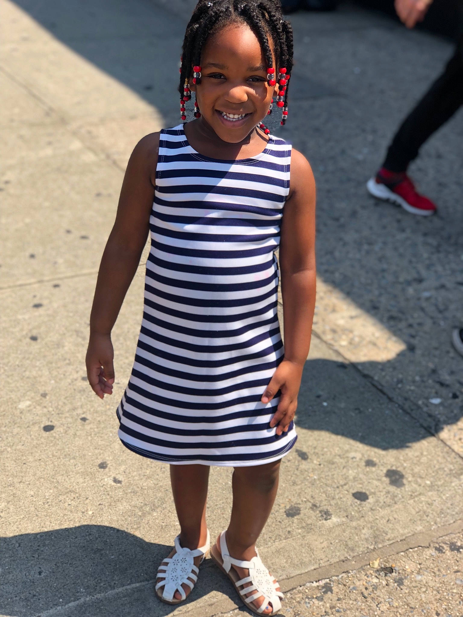 Nyomi is registered to the contest to win money with this photo: black_and_white, child, dress, fashion, footwear, joy, people, person, photography, play, shoe, smile, snapshot, street, street_fashion, style, summer, toddler, vacation, white