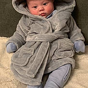 Jamie joined the competition — help win amazing prizes! baby, infant, robe, hood, ears, blanket, couch, soft, cozy, clothing, sitting, cute, face, expression, indoor, child, warm, comfort, person, portrait