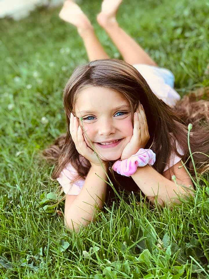 Azalea is registered to the contest to win money with this photo: beauty, child, child_model, facial_expression, fun, grass, grass_family, green, happy, joy, lawn, long_hair, meadow, people_in_nature, person, photography, plant, portrait, portrait_photography, sitting