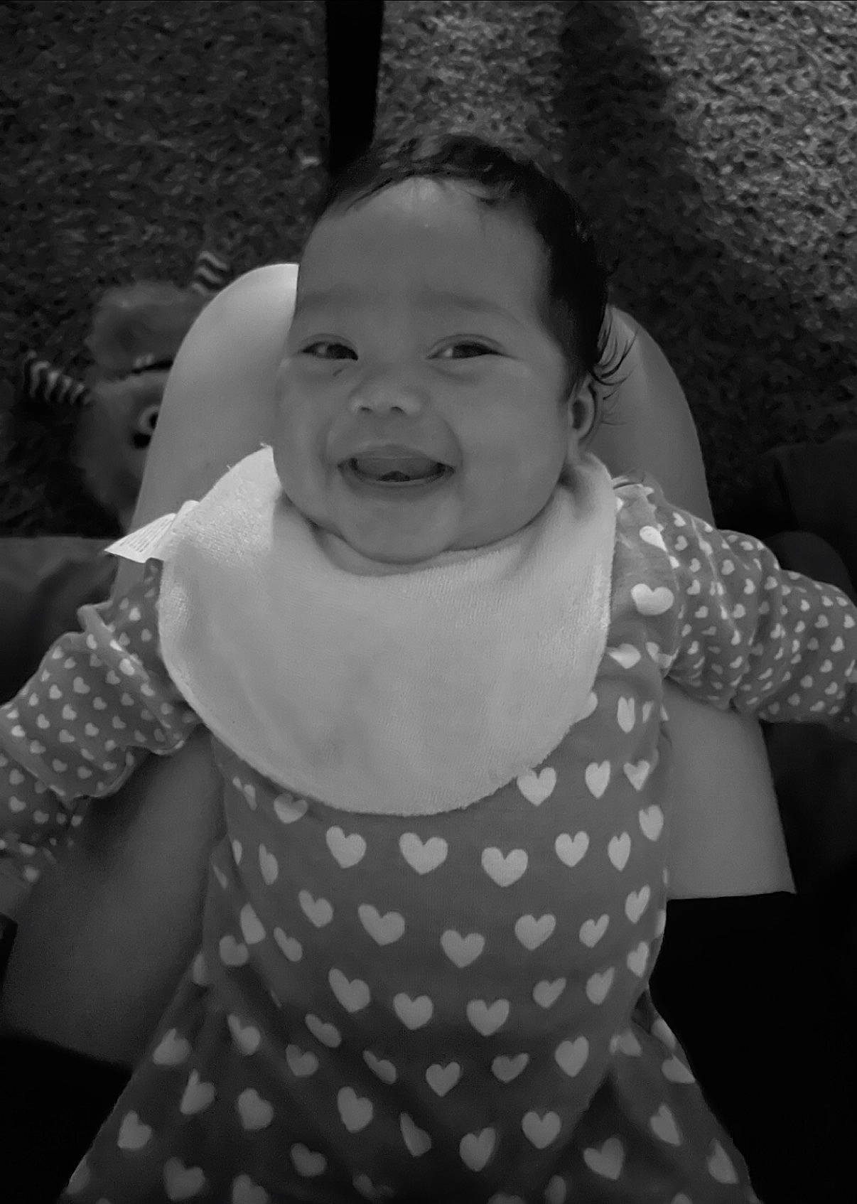 Maleah is registered to the contest to win money with this photo: baby_toddler_clothing, black, dress, face, facial_expression, hair, hairstyle, hand, happy, head, human_body, lip, organ, person, photograph, product, shoulder, skin, sleeve, smile