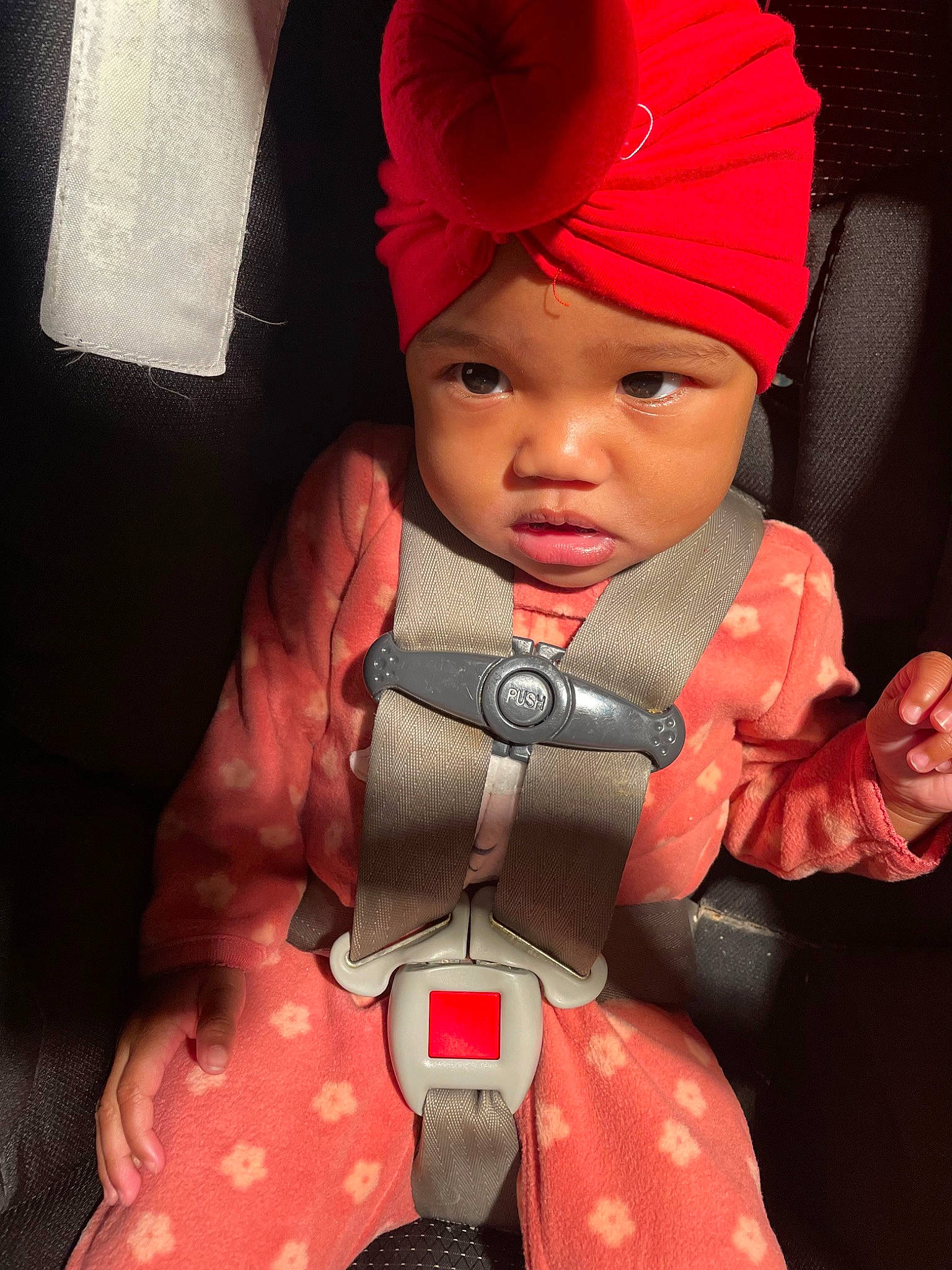 Kodi Nalani Williams joined the competition — help win amazing prizes! baby, baby_products, baby_toddler_clothing, cap, carmine, cheek, child, costume_hat, fashion_accessory, headgear, headwear, knit_cap, lifejacket, lip, magenta, person, personal_protective_equipment, pink, red, seat_belt