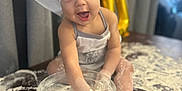 Liam joined the competition — help win amazing prizes! baby, child, chef_hat, flour, baking, rolling_pin, kitchen, messy, table, glass_bowl, cute, smiling, apron, indoor, playful, fun, cooking, happy, face, person
