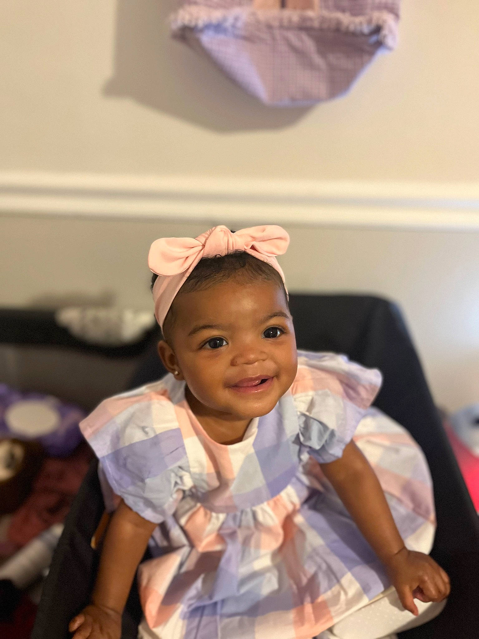 Alayah is registered to the contest to win money with this photo: baby, baby_toddler_clothing, child, dress, event, eye, flash_photography, fun, gesture, happy, joy, laugh, person, room, sitting, smile, toddler, tradition