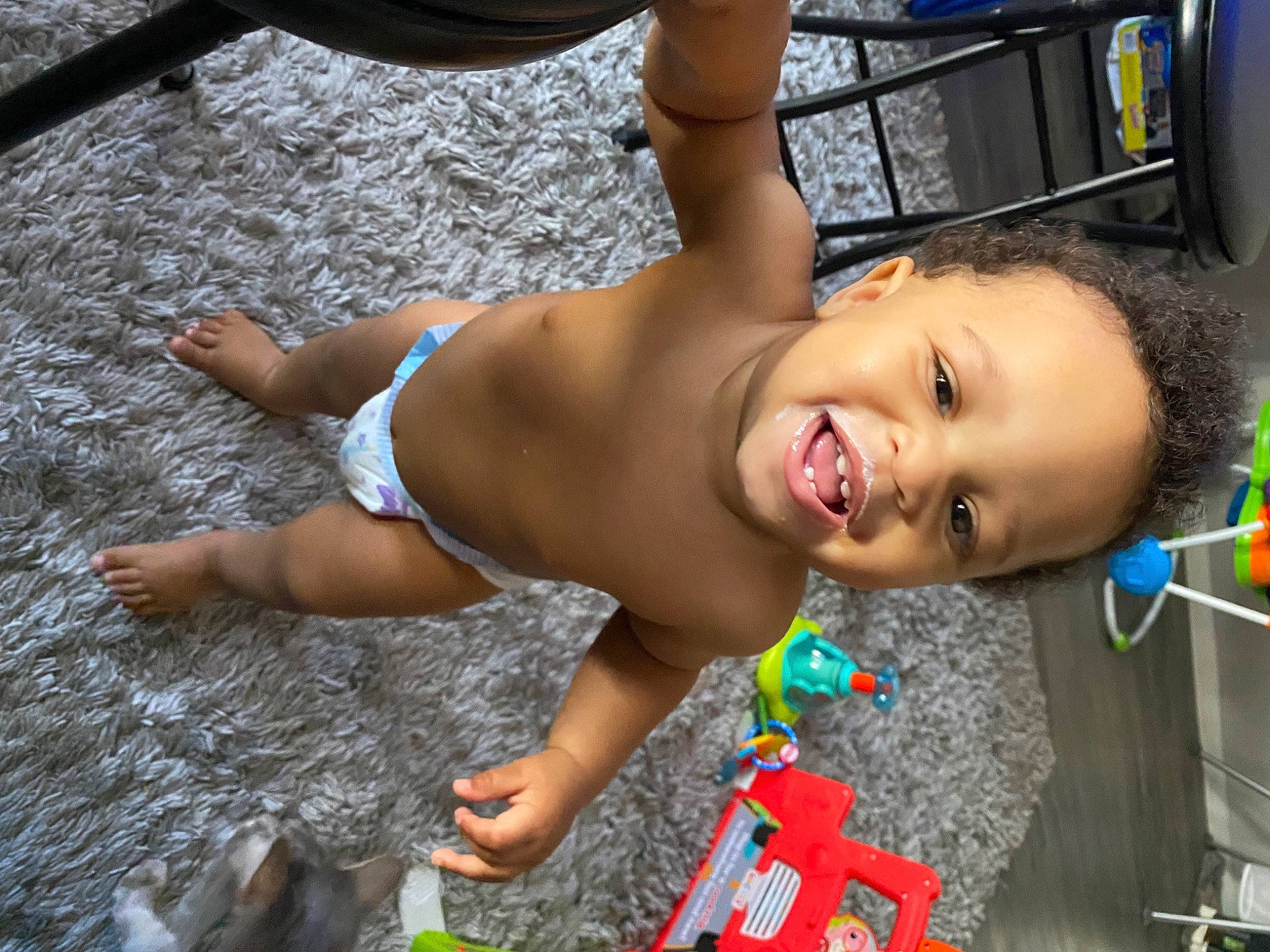 Swade is registered to the contest to win money with this photo: abdomen, baby, barechested, chest, child, facial_expression, foot, fun, happy, human_leg, leisure, navel, person, play, smile, swimwear, thigh, toddler, trunk, underpants