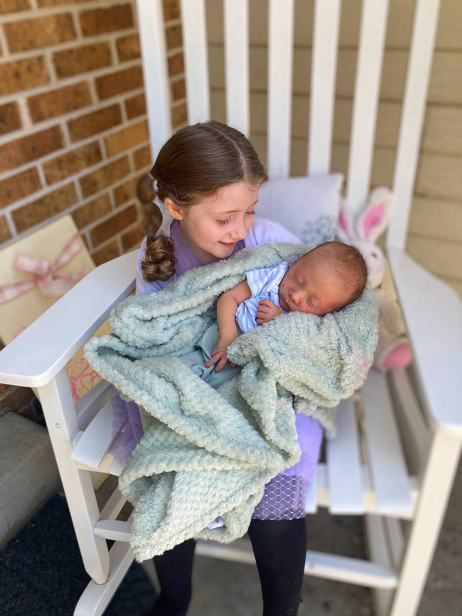 Scarlett joined the competition — help win amazing prizes! baby, baby_products, baby_toddler_clothing, chair, child, comfort, event, face, hairstyle, happy, infant_bed, leisure, pattern, person, purple, room, sitting, skin, toddler, vacation