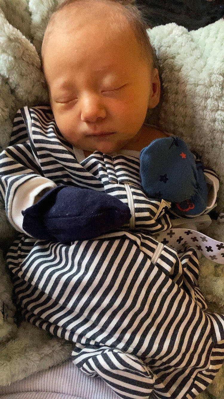 Oliver is registered to the contest to win money with this photo: baby, baby_toddler_clothing, cheek, child, chin, comfort, eye, face, grass, head, iris, linens, lip, nose, pattern, person, sitting, skin, sleeve, textile