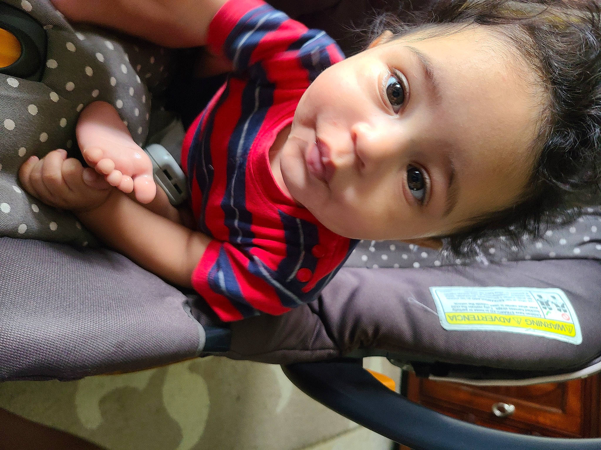 Malik joined the competition — help win amazing prizes! auto_part, baby, child, cool, electric_blue, eye, flash_photography, fun, hand, happy, human_body, pattern, person, personal_protective_equipment, plaid, plant, sitting, skin, smile, toddler