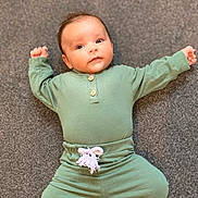 Tyler joined the competition — help win amazing prizes! arms_outstretched, baby, carpet, casual, child, comfort, cute, expression, face, floor, green_clothing, indoors, infant, lying_down, pajamas, portrait, relaxed, small_hands, soft_lighting, young_child