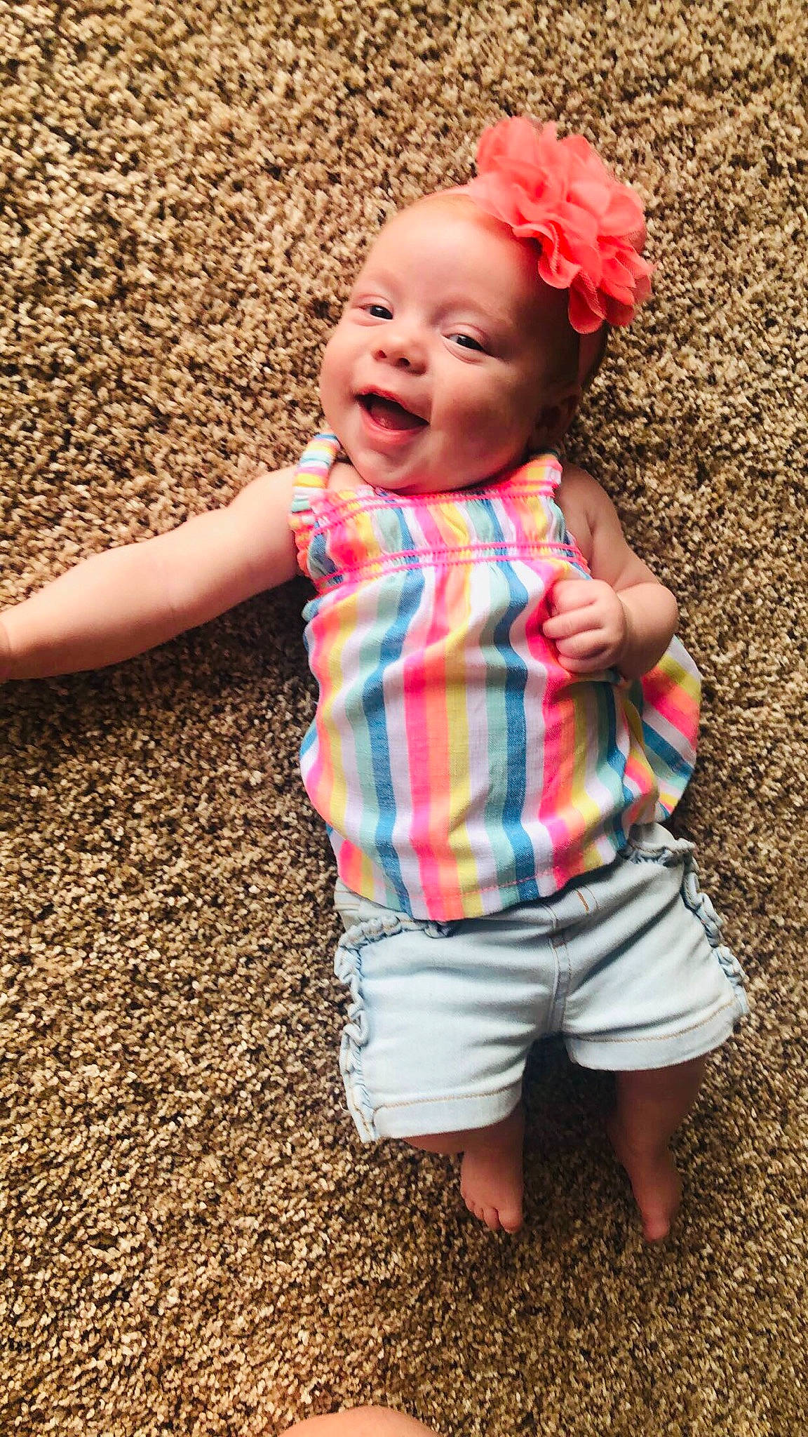 Shiloh is registered to the contest to win money with this photo: baby_toddler_clothing, clothing, face, flower, grass, happy, leaf, people, people_in_nature, person, photograph, pink, red, shorts, skin, sleeve, smile, standing, summer, t_shirt