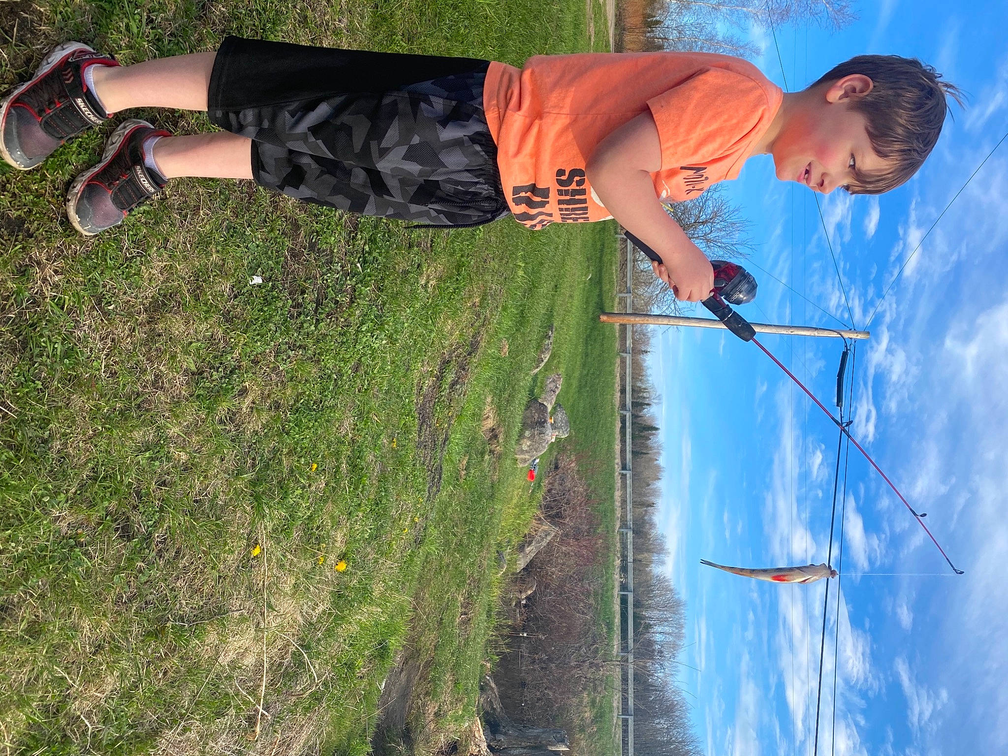 Gavin joined the competition — help win amazing prizes! adventure, blue, cloud, electric_blue, fun, grass, grass_family, head, human_body, human_leg, joy, knee, leisure, people_in_nature, person, plant, recreation, shorts, sky, sport_climbing