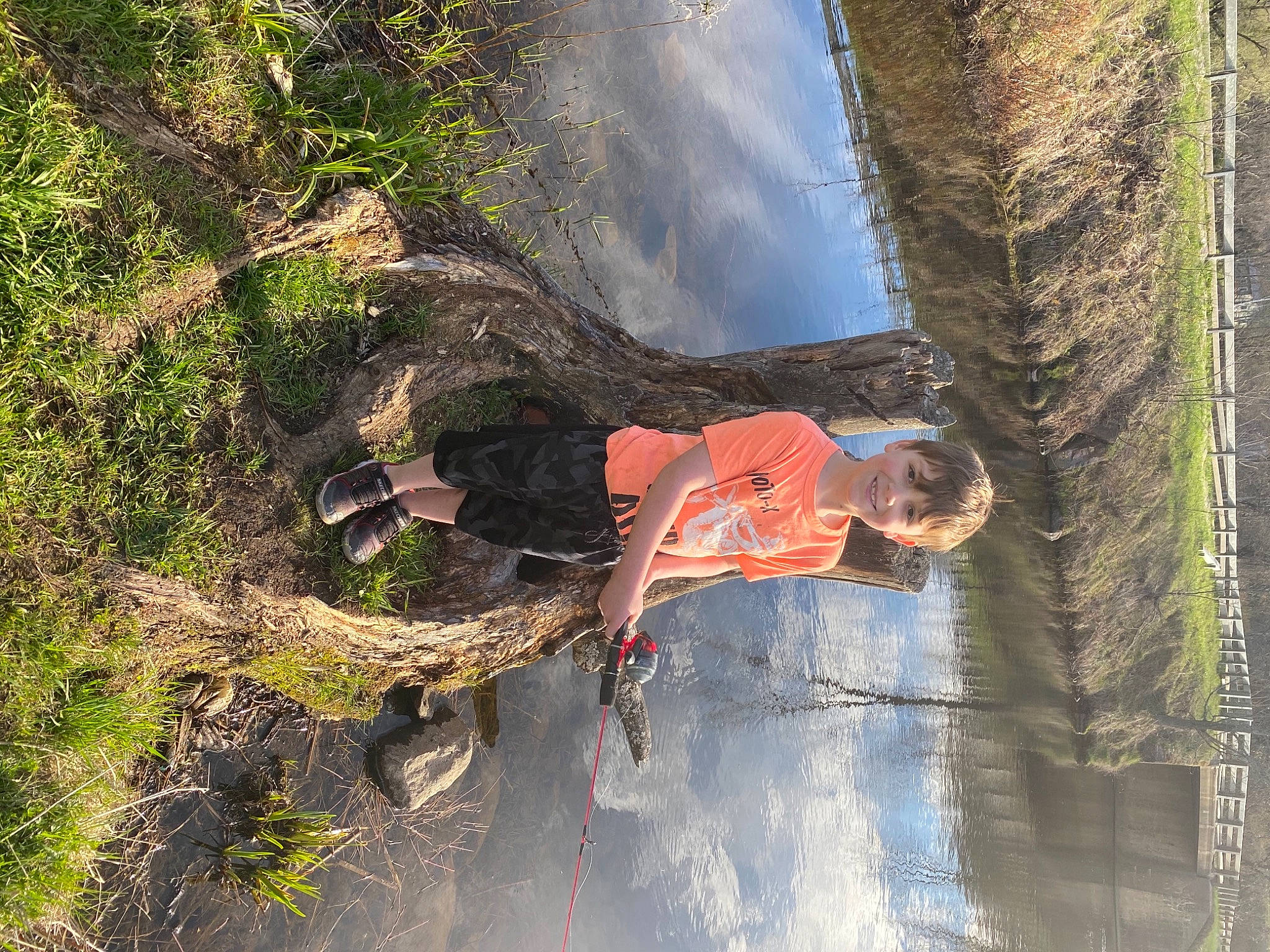 Gavin is registered to the contest to win money with this photo: adventure, branch, forest, fun, grass, joy, jungle, landscape, leisure, people_in_nature, person, plant, rainforest, recreation, reflection, rock, soil, tree, trunk, water