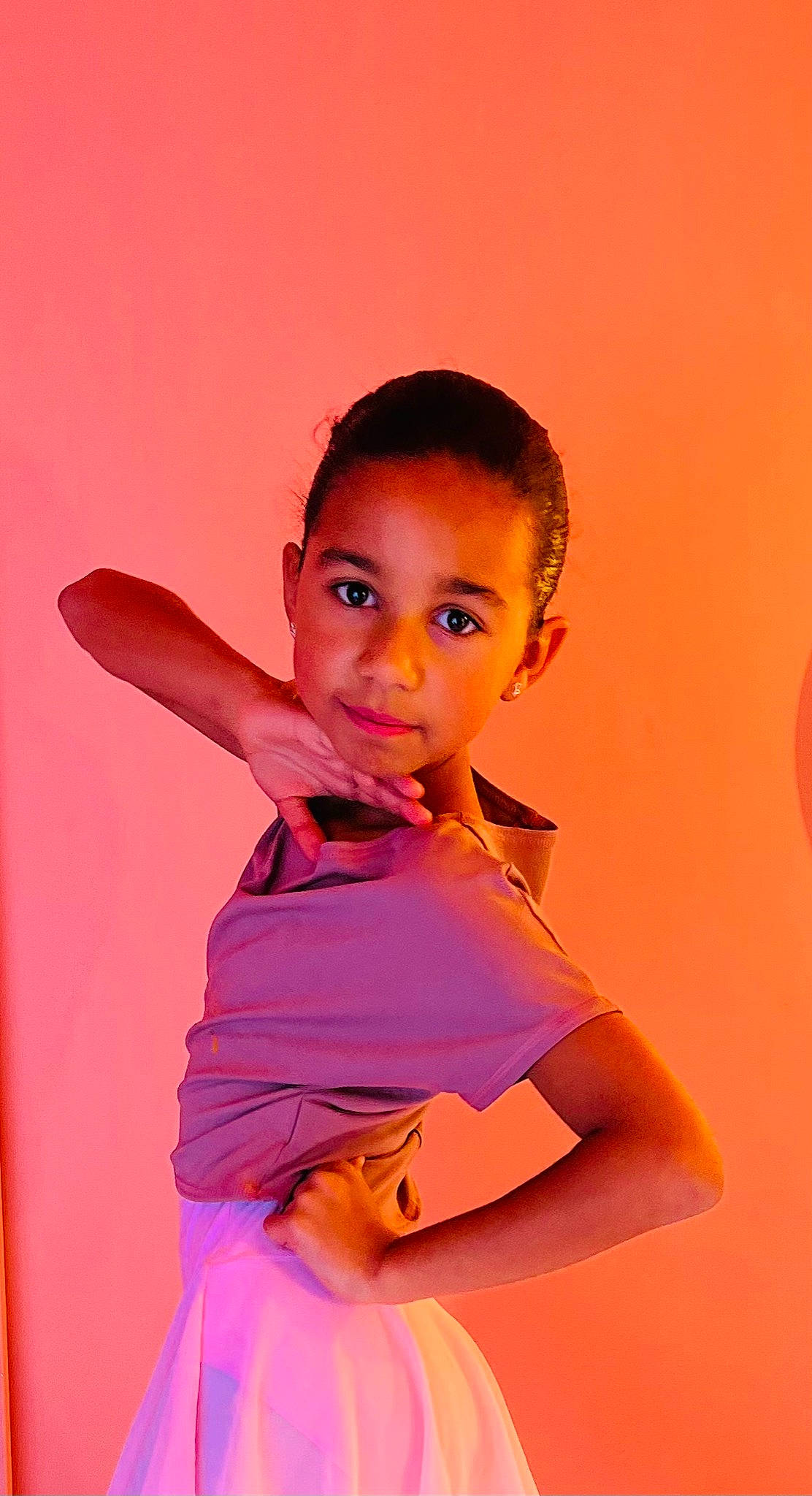 Clémence participe au concours pour gagner de l'argent avec cette photo : abdomen, beauty, elbow, electric_blue, fashion_design, flash_photography, formal_wear, fun, gesture, happy, human_leg, magenta, neck, peach, person, sitting, sleeve, thigh, toddler, trunk