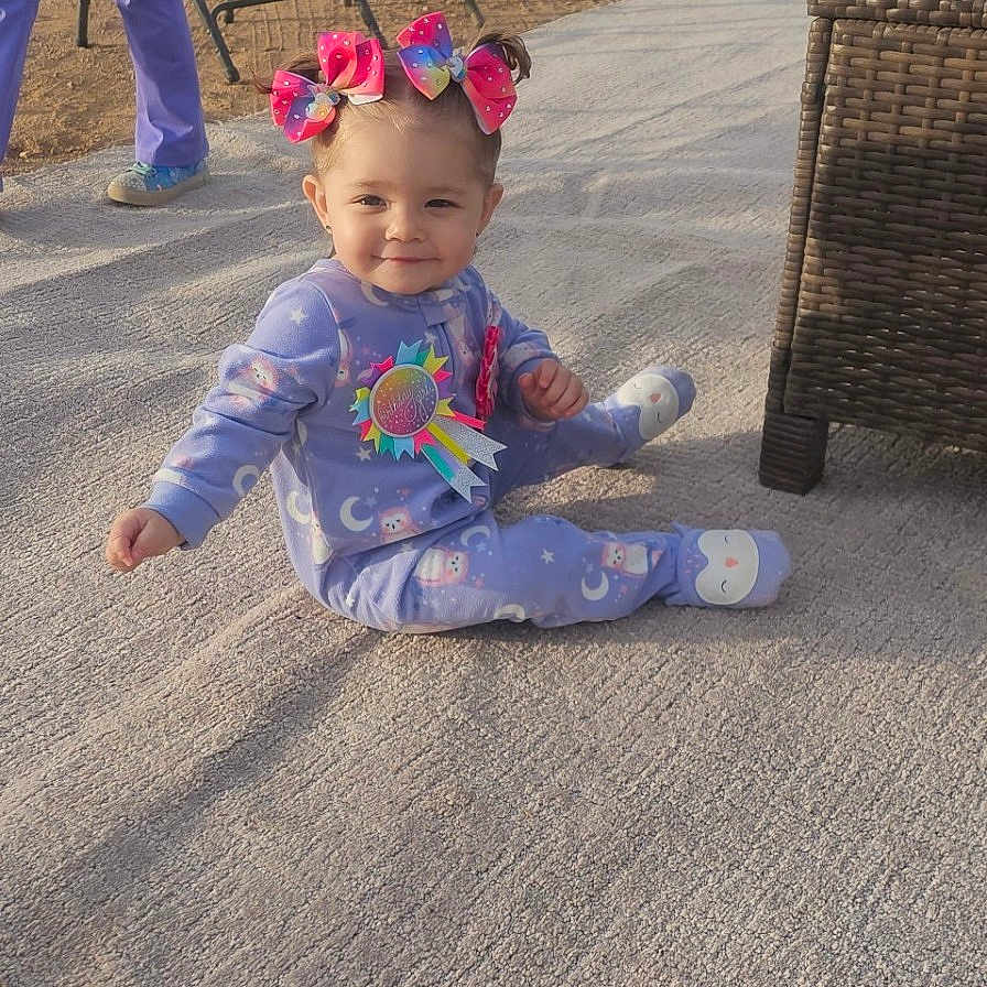 Azza is registered to the contest to win money with this photo: baby, clothing, face, female, girl, grass, hat, head, nature, outdoors, pants, park, person, photography, plant, playarea, portrait, soil, summer, teen