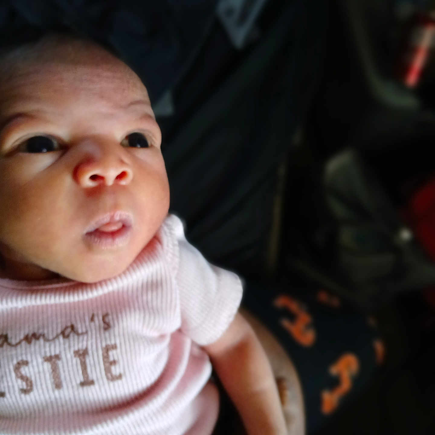 Armani joined the competition — help win amazing prizes! baby, blurred_background, closeup, clothing, cute, expression, eyes, face, hand, holding, human, indoor, infant, newborn, patterned_pants, person, pink_shirt, portrait, skin, soft_light