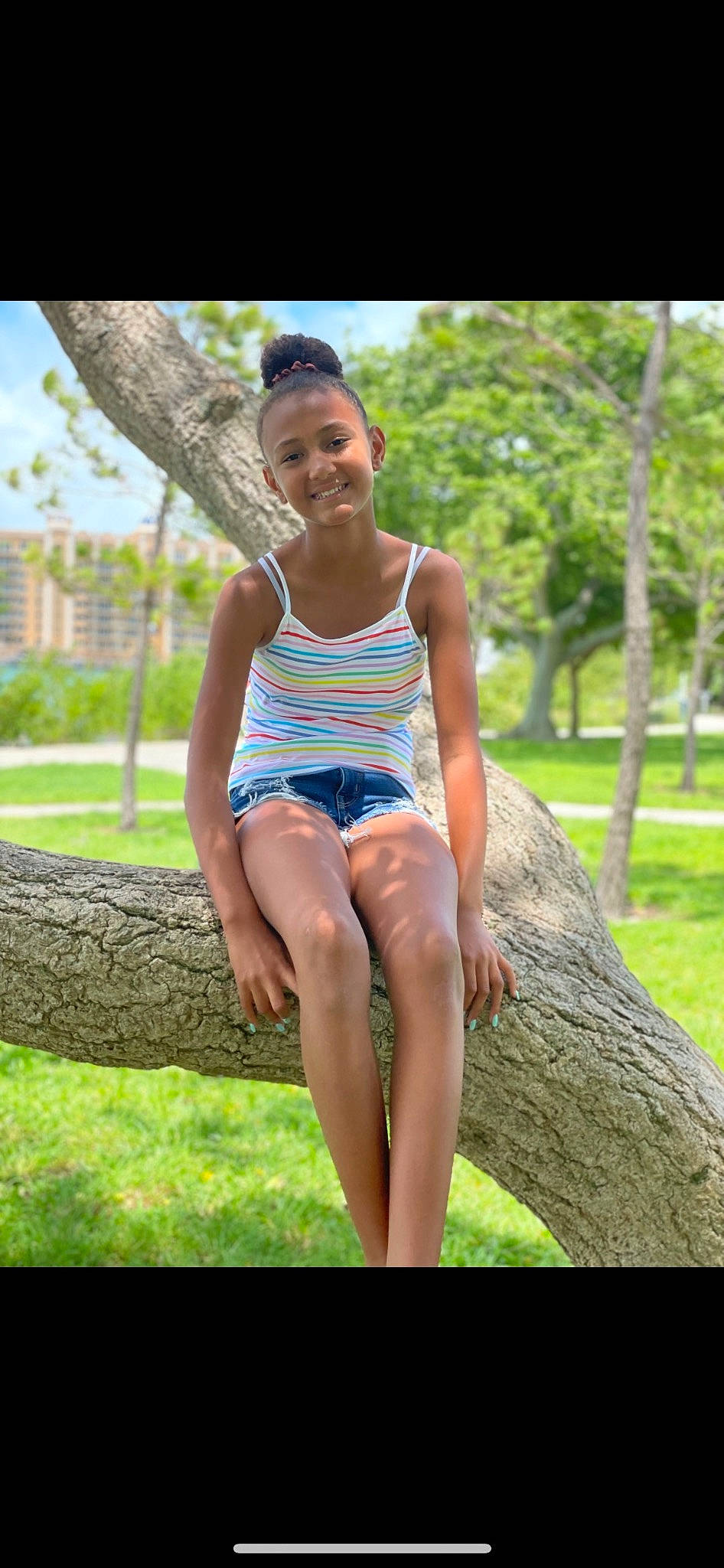 Mya is registered to the contest to win money with this photo: barefoot, electric_blue, flash_photography, foot, fun, grass, happy, human_leg, joy, knee, leisure, people_in_nature, person, plant, recreation, sitting, smile, summer, thigh, tree