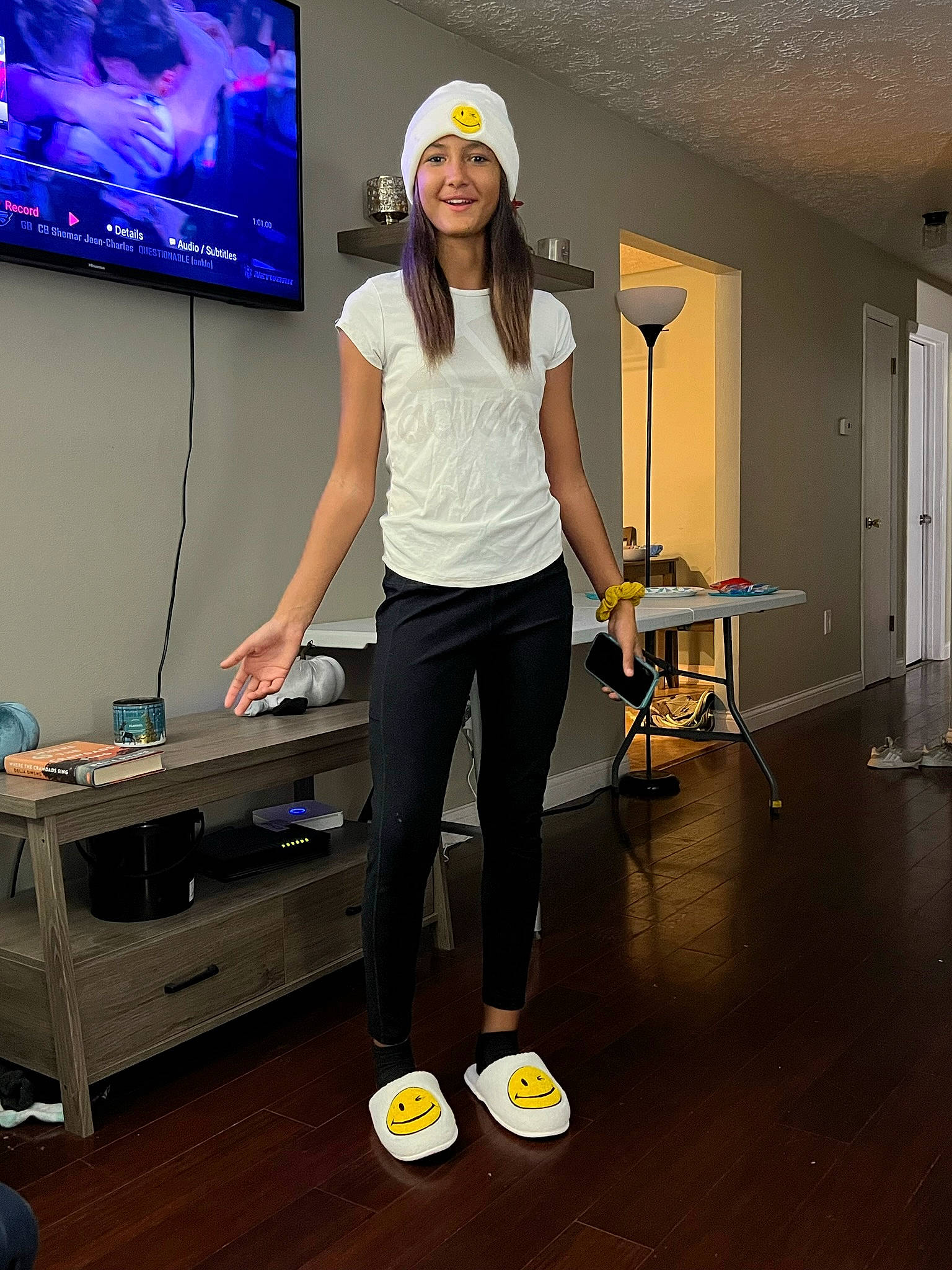 Mya joined the competition — help win amazing prizes! electric_blue, entertainment, event, eyewear, fashion_design, flooring, fun, hardwood, headwear, human_leg, joy, knee, person, sleeve, smile, sportswear, standing, table, television, thigh