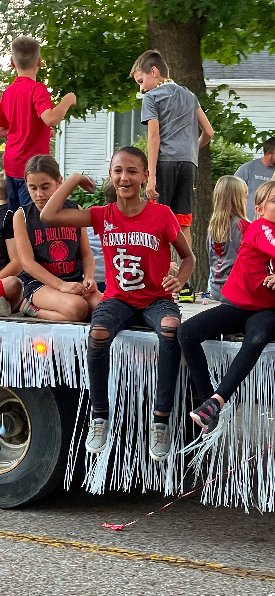 Mya joined the competition — help win amazing prizes! automotive_design, automotive_exterior, automotive_tire, crowd, event, fun, happy, joy, leisure, mammal, motor_vehicle, person, recreation, shorts, sneakers, style, t_shirt, team, tire, vehicle