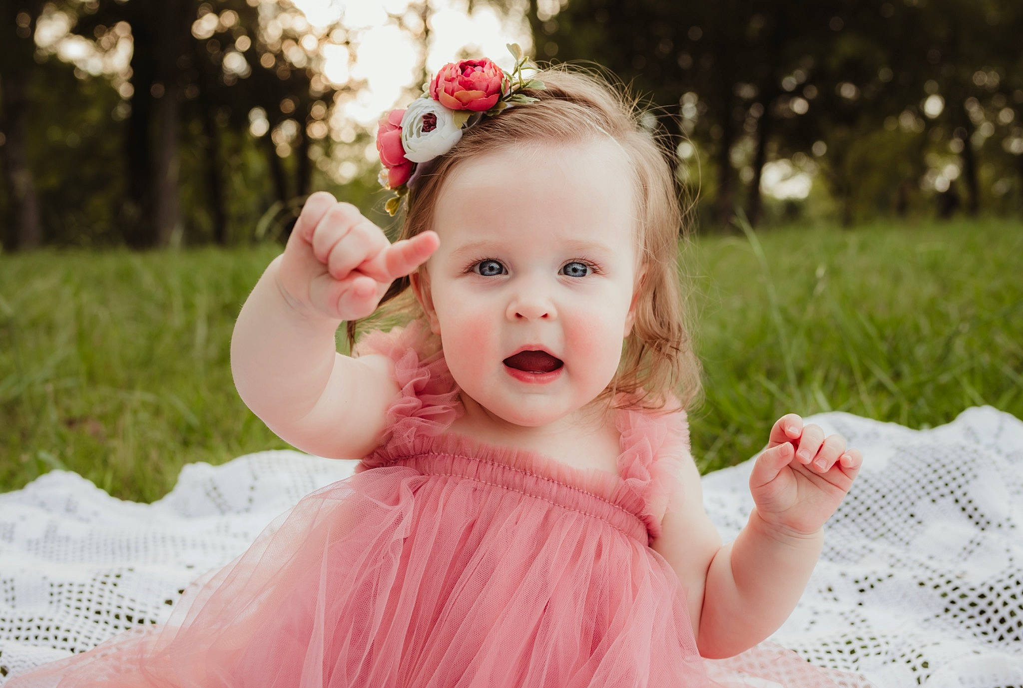 Atlas is registered to the contest to win money with this photo: baby, baby_toddler_clothing, child, dress, eye, flash_photography, fun, gesture, grass, happy, headband, headpiece, people_in_nature, person, photograph, pink, plant, skin, summer, sunlight