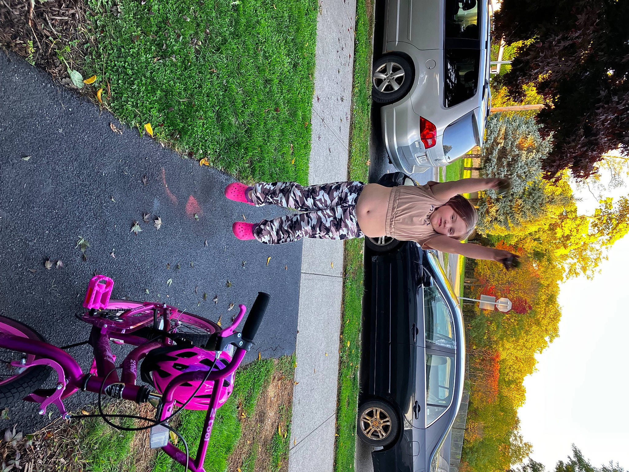 Ariel joined the competition — help win amazing prizes! asphalt, automotive_design, automotive_exterior, automotive_lighting, automotive_tire, car, grass, green, land_vehicle, light, motor_vehicle, person, plant, tire, tree, vehicle, vehicle_door, wall, wheel, white