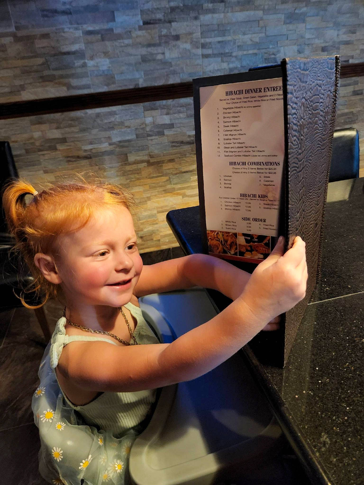 Marianna is registered to the contest to win money with this photo: child, flash_photography, font, fun, happy, joy, leisure, person, recreation, room, sitting, smile, toddler, travel, wood