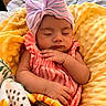 Esme joined the competition — help win amazing prizes! baby, sleeping, bow, headwear, blanket, yellow, pink, striped, infant, cute, soft, cushion, hand, face, closed_eyes, portrait, indoors, child, resting, peaceful