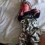 baby, infant, pacifier, headband, camo_pants, white_blanket, foot, hand, clothing, lying_down, soft_texture, newborn, cute, sleepwear, child, person, indoors, fabric, resting, baby_accessory