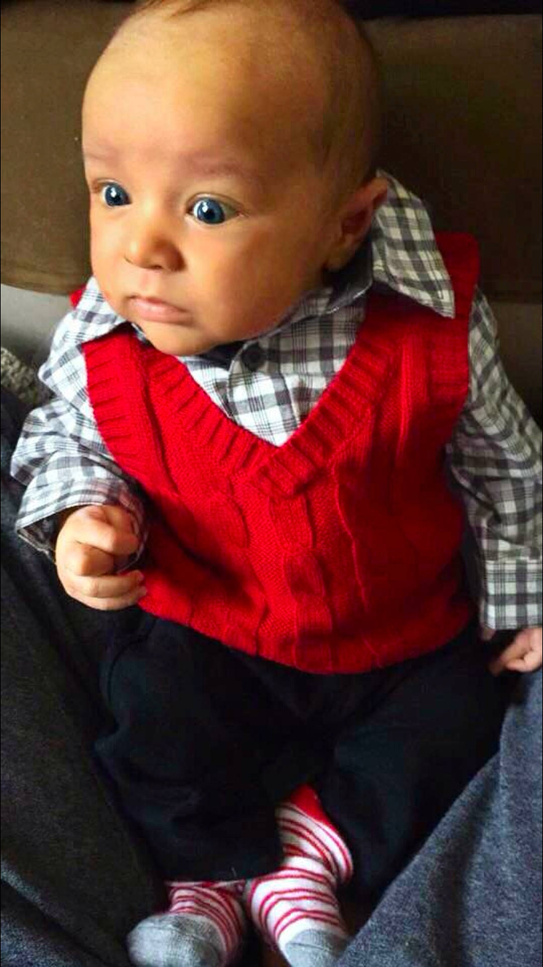 Layden is registered to the contest to win money with this photo: cheek, child, girl, infant, outerwear, person, plaid, product, red, sitting, skin, smile, textile, toddler