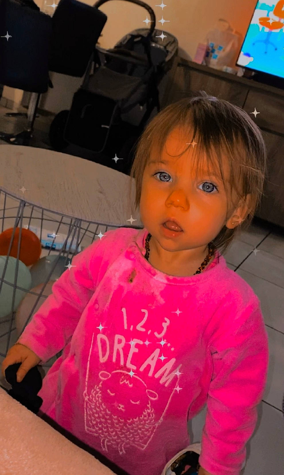 Mylia participe au concours pour gagner de l'argent avec cette photo : baby_toddler_clothing, chair, cheek, child, cool, eyelash, forehead, fun, hairstyle, happy, magenta, mouth, nose, person, pink, room, sitting, sleeve, t_shirt, television