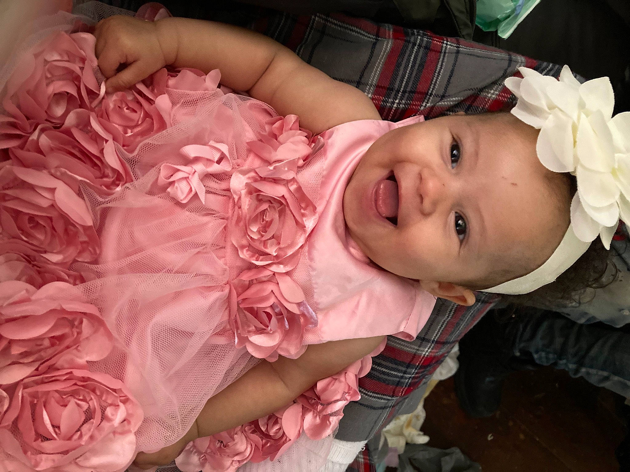 Miracle Yvette is registered to the contest to win money with this photo: baby, baby_toddler_clothing, cheek, dress, happy, hat, headgear, headpiece, human_body, iris, lip, person, petal, pink, plant, rose, skin, smile, tartan, textile