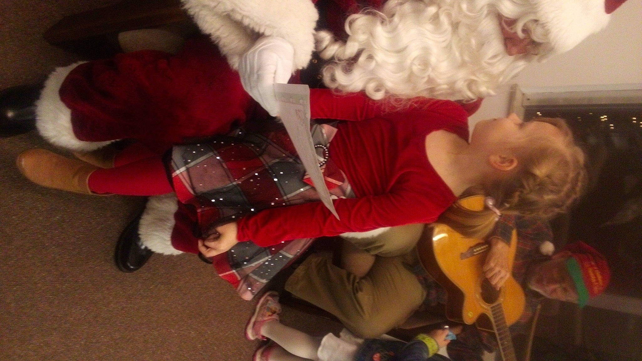 Kierah joined the competition — help win amazing prizes! carmine, child, christmas_eve, costume, event, fictional_character, friendship, fun, fur, fur_clothing, gesture, happy, holiday, lap, party, person, room, santa_claus, toddler, tree